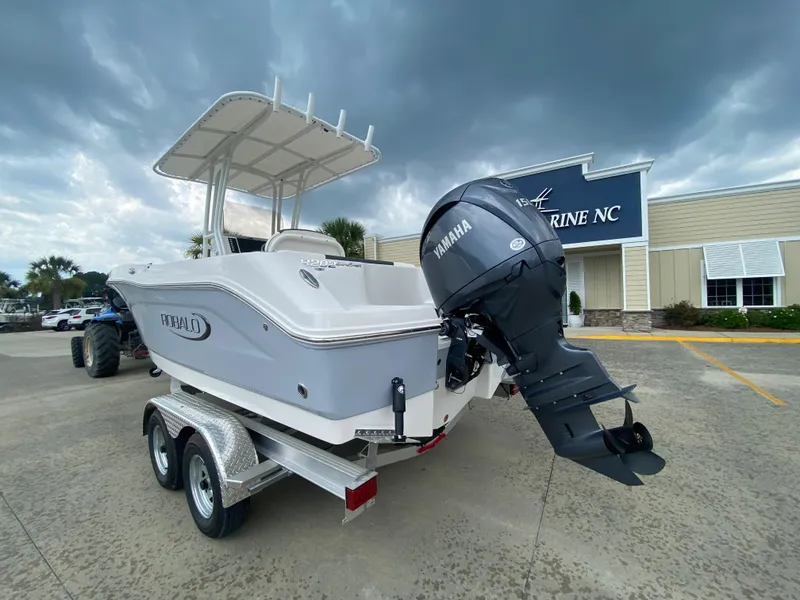 Slide: The Image of 2026 Robalo 202 EXPLORER boat with Yamaha engine on trailer, parked outside Marine NC. - 2