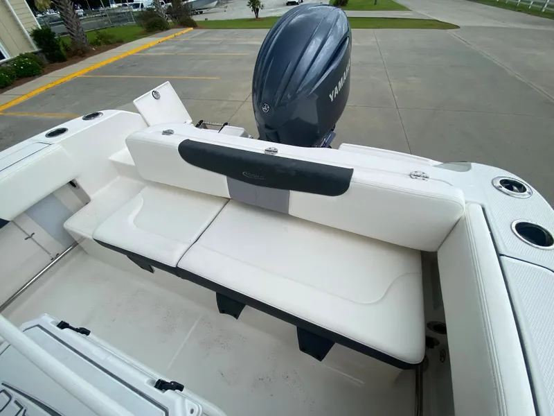 Slide: The Image of 2026 Robalo 202 EXPLORER boat with Yamaha engine, featuring white seating and cup holders. - 8