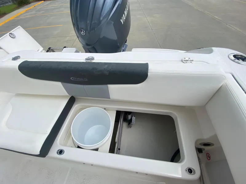 Slide: The Image of 2026 Robalo 202 EXPLORER boat interior with storage compartment and Yamaha engine. - 9
