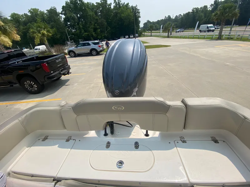 Slide: The Image of 2026 Key West 203 FS boat with outboard motor in parking lot. - 7