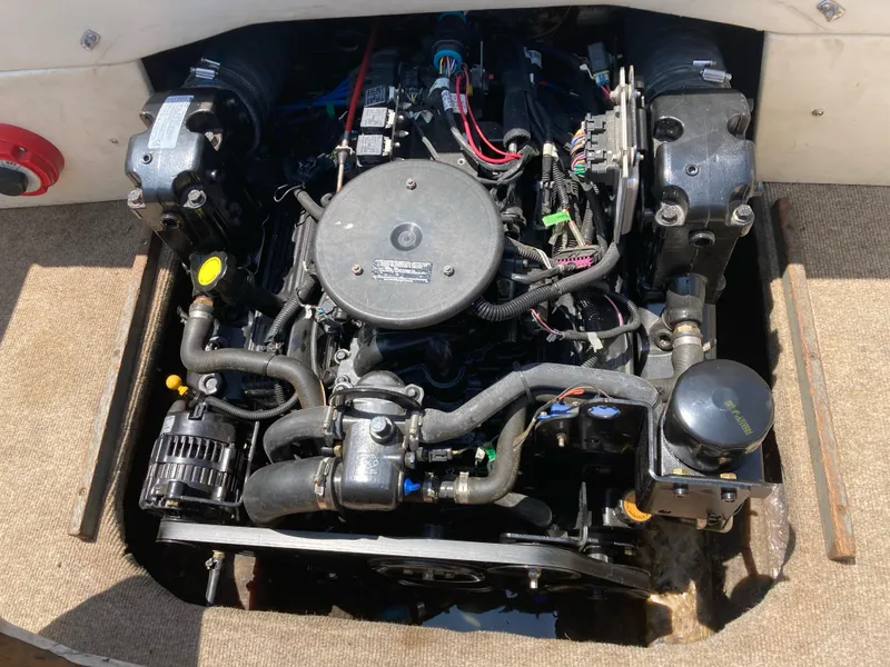 Slide: The Image of 1970 Chris-Craft Lancer 23 boat engine compartment with visible engine components. - 21