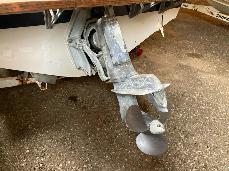 Slide: The Image of 1970 Chris-Craft Lancer 23 boat propeller and stern drive in storage. - 23