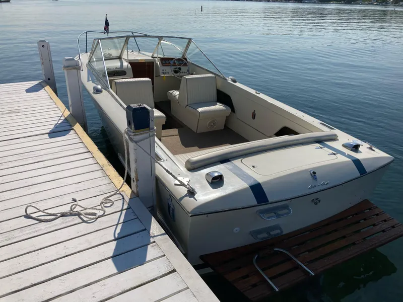 Slide: The Image of 1970 Chris-Craft Lancer 23 boat docked at a pier on a sunny day. - 7
