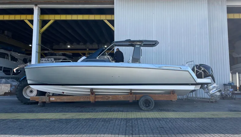 Slide: The Image of 2025 Schaefer V33 boat in a marina, side view. - 1