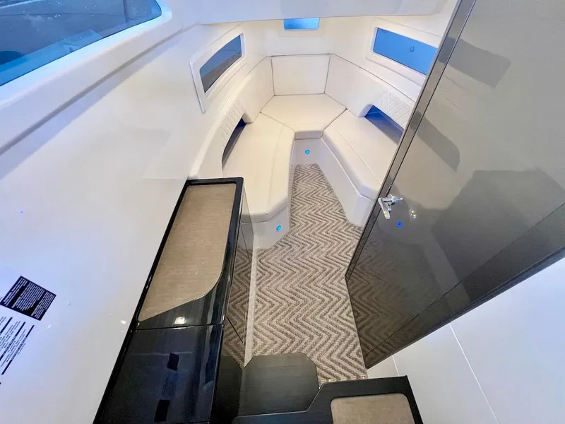 Slide: The Image of Interior cabin of 2025 Schaefer V33 yacht with modern seating and carpet. - 24