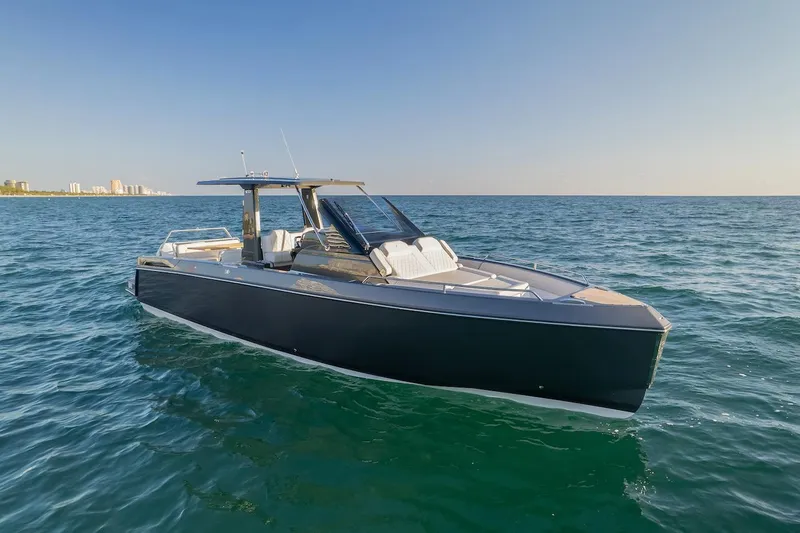 Slide: The Image of 2025 Schaefer V33 boat cruising on open water. - 9
