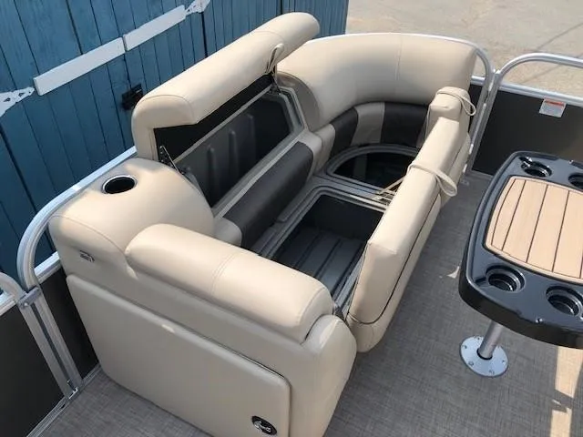 Slide: The Image of 2023 Sun Tracker Party Barge 22 DLX interior seating and table setup. - 10