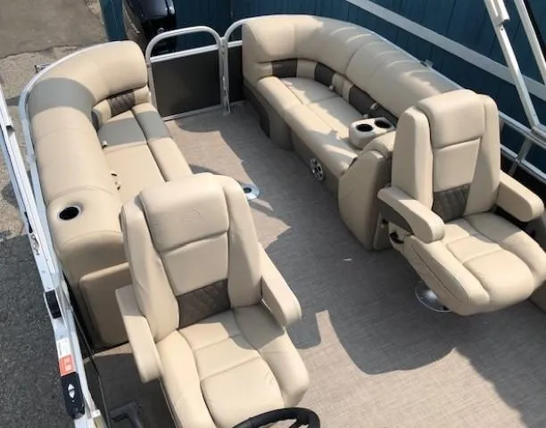 Slide: The Image of 2023 Sun Tracker Party Barge 22 DLX pontoon boat with beige seating and spacious layout. - 17