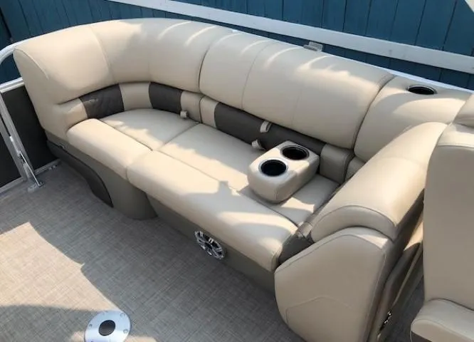 Slide: The Image of 2023 Sun Tracker Party Barge 22 DLX pontoon boat with beige seating and cup holders. - 18