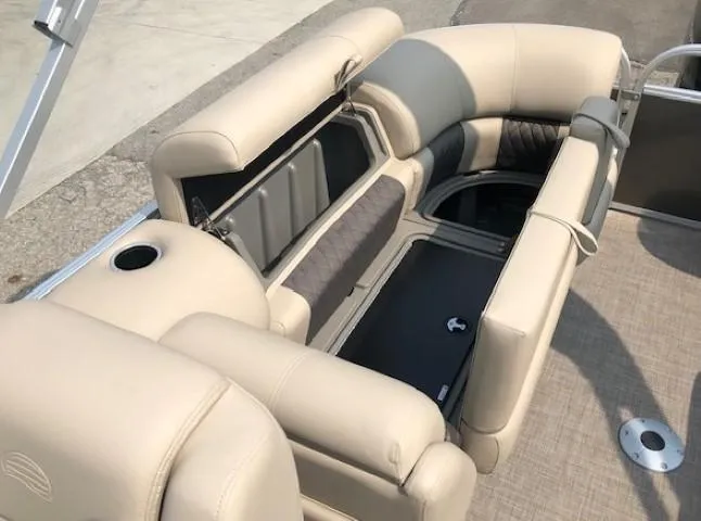 Slide: The Image of 2023 Sun Tracker Party Barge 22 DLX interior seating and storage compartments. - 21