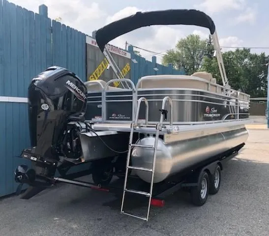 Slide: The Image of 2023 Sun Tracker Party Barge 22 DLX pontoon boat on trailer. - 3