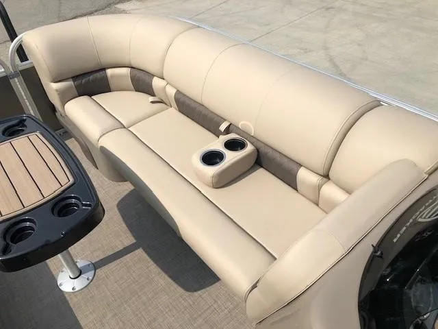 Slide: The Image of 2023 Sun Tracker Party Barge 22 DLX interior seating with cup holders. - 7