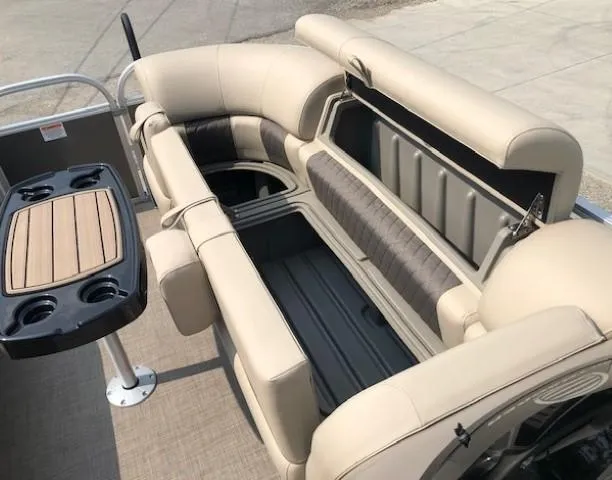 Slide: The Image of 2023 Sun Tracker Party Barge 22 DLX interior seating and table setup. - 8