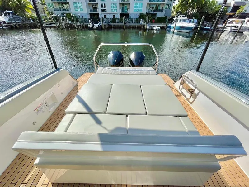 Slide: The Image of Schaefer V33 2025 model boat with a spacious sunbed and twin outboard motors. - 19