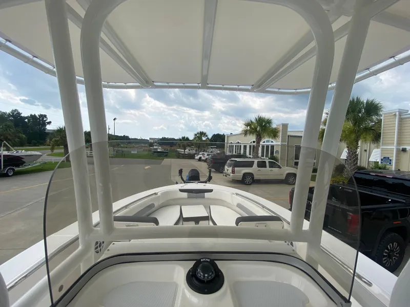 Slide: The Image of 2024 Robalo 202 EXPLORER boat interior view with canopy and windshield. - 15