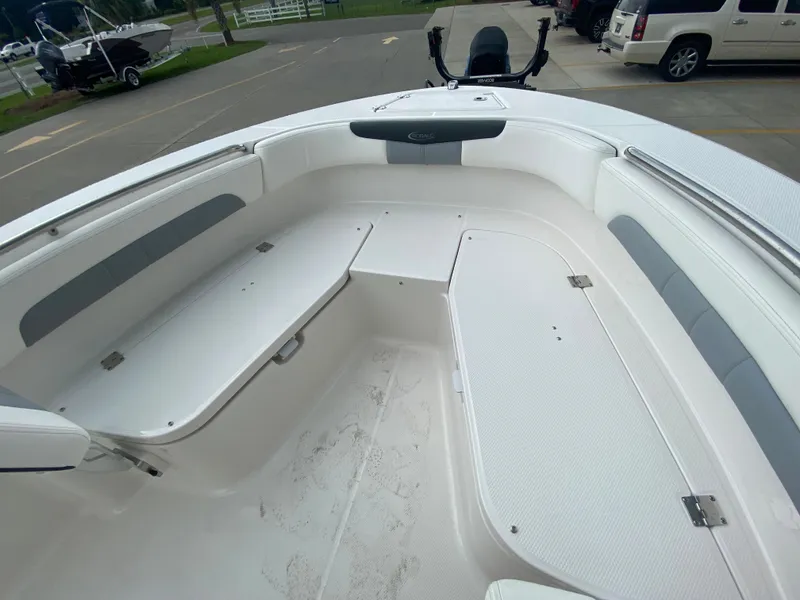 Slide: The Image of 2024 Robalo 202 EXPLORER boat interior with spacious seating and storage compartments. - 18