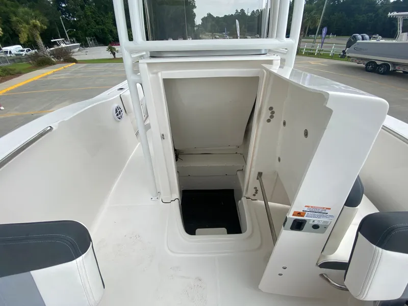 Slide: The Image of 2024 Robalo 202 EXPLORER boat interior with open storage compartment. - 22