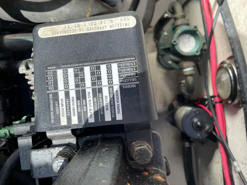 Slide: The Image of Engine compartment of a 2004 SeaSport 2400 XL boat showing engine details and components. - 6