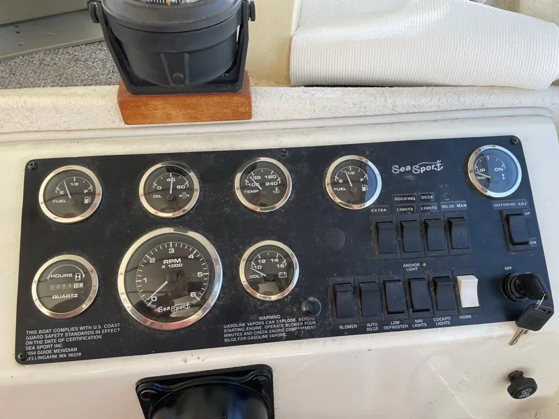 Slide: The Image of 2004 SeaSport 2400 XL dashboard with gauges and controls - 7