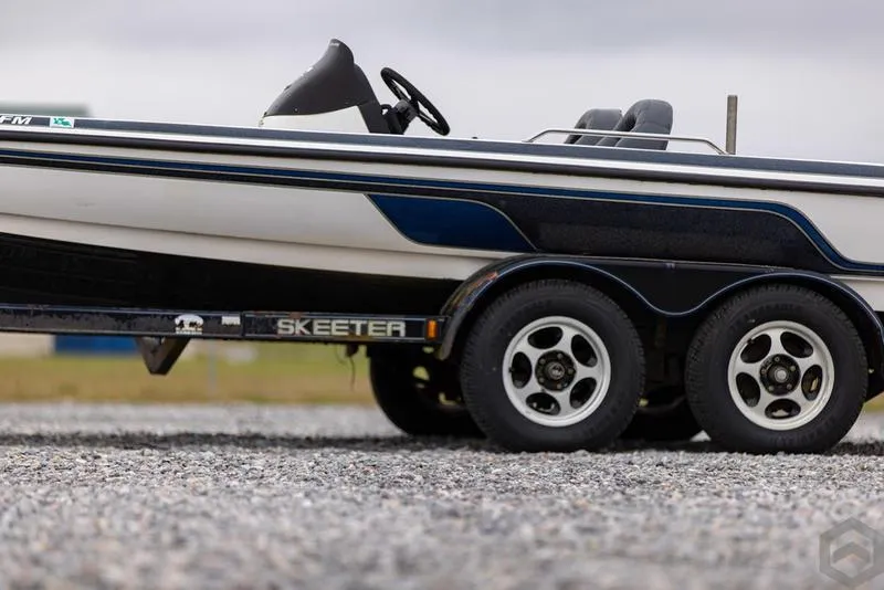 Slide: The Image of 2004 Skeeter ZX225 boat on a trailer, side view. - 14