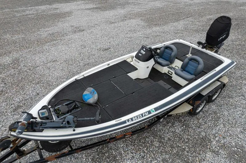Slide: The Image of 2004 Skeeter ZX225 fishing boat with dual seats and motor on trailer. - 15