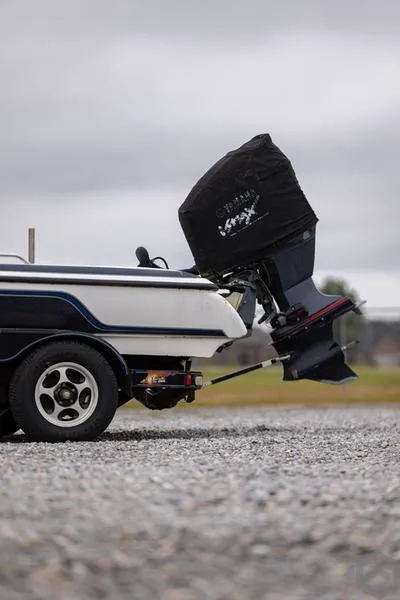 Slide: The Image of 2004 Skeeter ZX225 boat on trailer with covered outboard motor. - 8