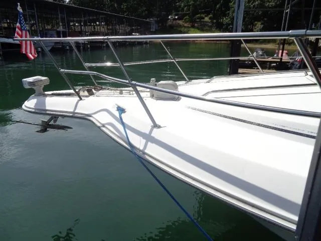 Slide: The Image of 1995 Sea Ray 400 Express Cruiser docked at marina. - 14