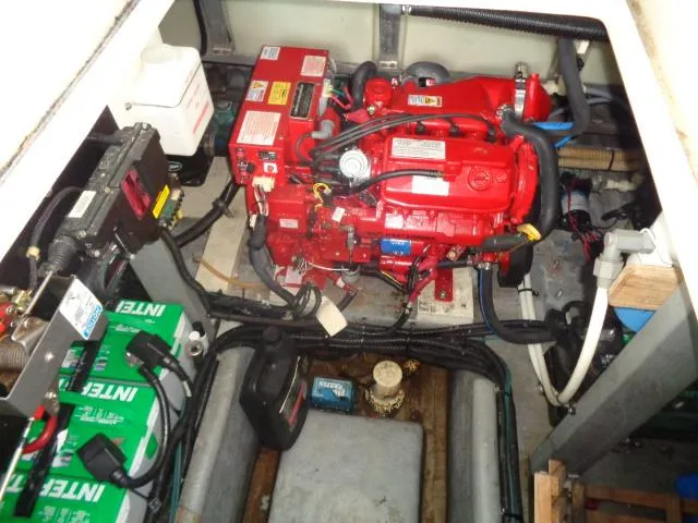 Slide: The Image of Engine compartment of a 1995 Sea Ray 400 Express Cruiser with red engine and batteries. - 18