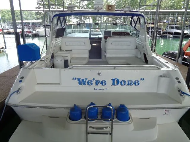 Slide: The Image of 1995 Sea Ray 400 Express Cruiser docked at marina, rear view. - 4