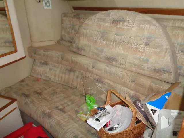 Slide: The Image of Interior seating area of a 1995 Sea Ray 400 Express Cruiser with clutter. - 9