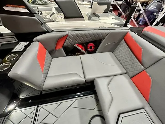 Slide: The Image of 2024 Tigé Z3 boat interior with gray and red seating. - 17