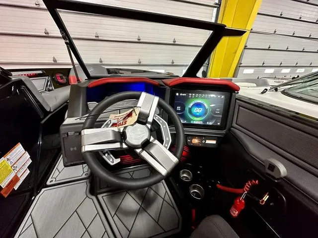 Slide: The Image of 2024 Tigé Z3 boat dashboard with touchscreen display and modern steering wheel. - 18
