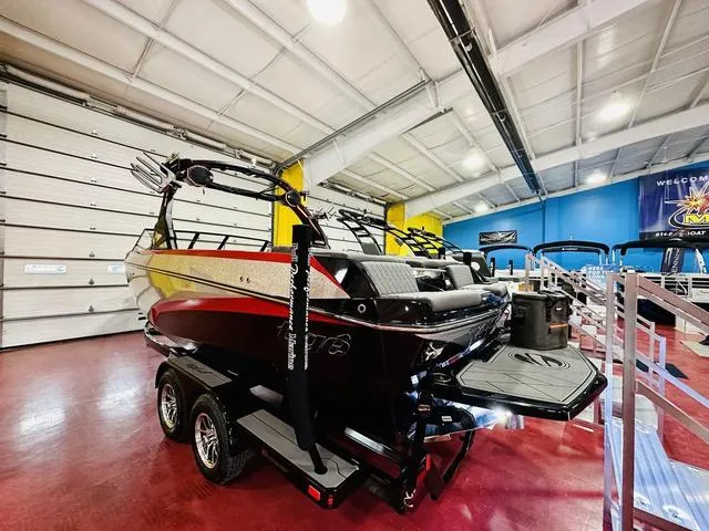 Slide: The Image of 2024 Tigé Z3 boat on display in a showroom. - 4