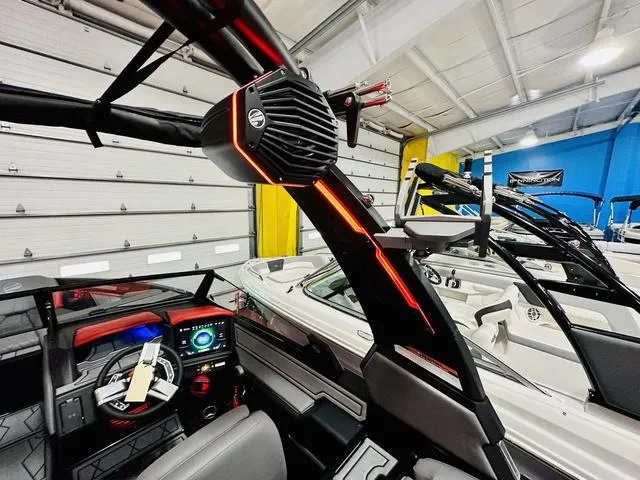 Slide: The Image of 2024 Tigé Z3 boat interior with advanced dashboard and sound system. - 7