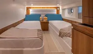 Slide: The Image of Interior cabin of 2024 Solaris Power 48' Lobster yacht with twin beds. - 8