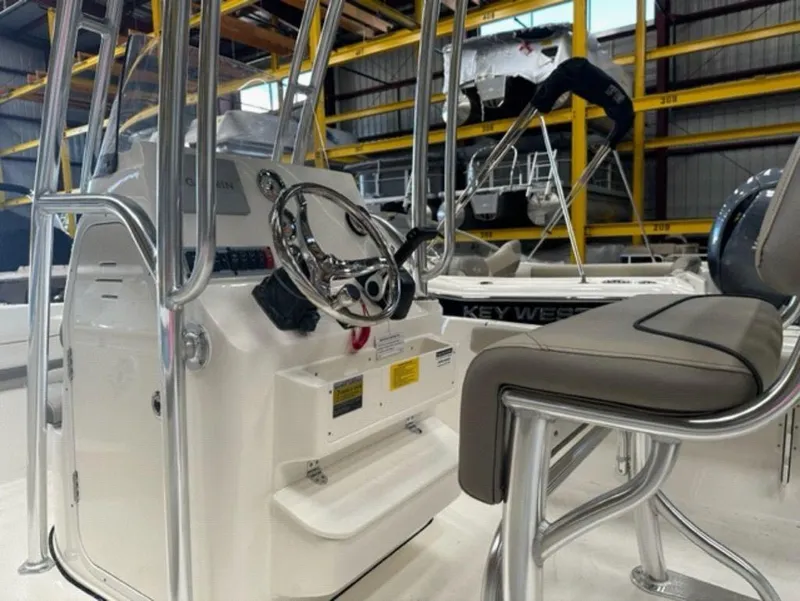 Slide: The Image of 2024 Key West 189 FS boat interior with steering console and seating. - 10