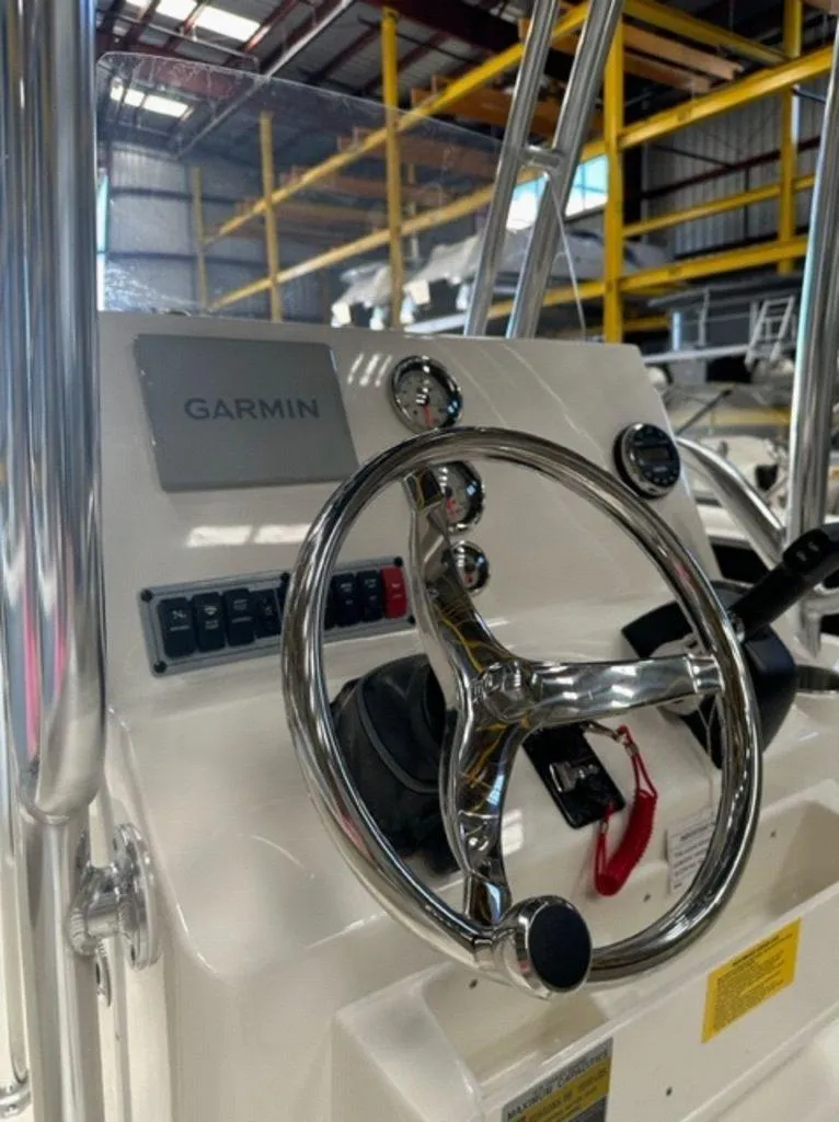 Slide: The Image of 2024 Key West 189 FS boat dashboard with Garmin navigation system. - 2