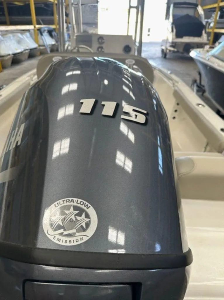 Slide: The Image of 2024 Key West 189 FS boat with Yamaha 115 outboard engine in a showroom. - 5