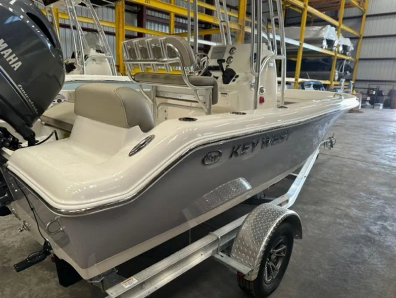 Slide: The Image of 2024 Key West 189 FS boat on trailer in warehouse. - 9