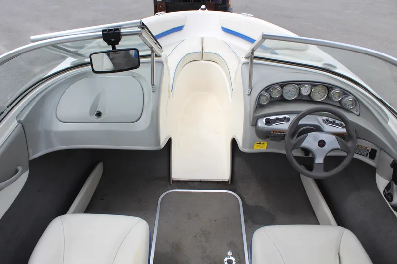 Slide: The Image of 2007 Bayliner 185 Bowrider interior with steering wheel, dashboard, and seating. - 10