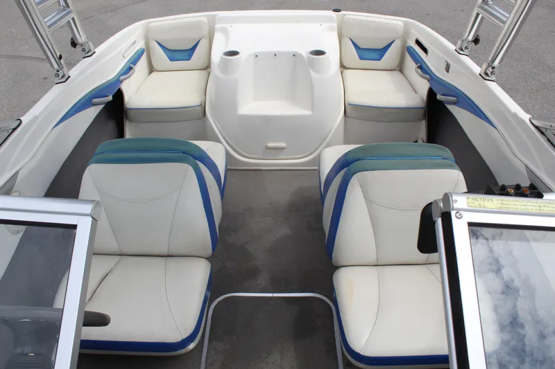 Slide: The Image of 2007 Bayliner 185 Bowrider interior with white and blue seating arrangement. - 13