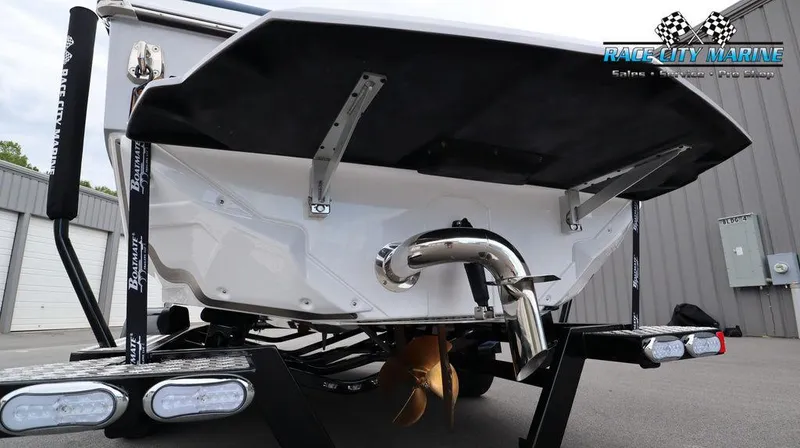 Slide: The Image of 2024 Nautique GS24 boat rear view at Race City Marine. - 10