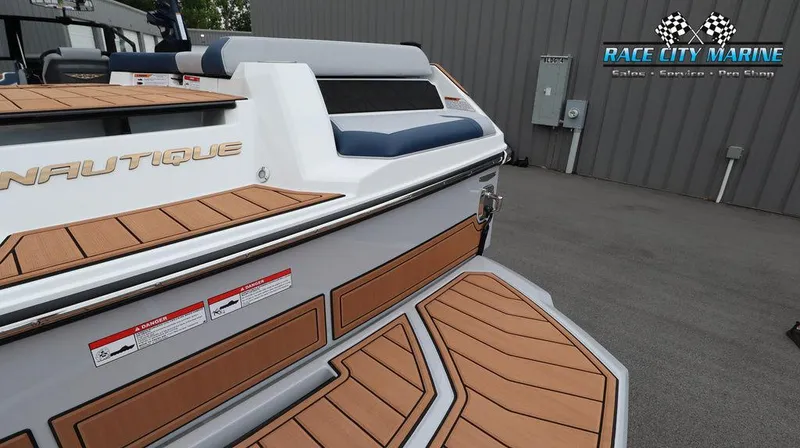 Slide: The Image of 2024 Nautique GS24 boat at Race City Marine dealership. - 12