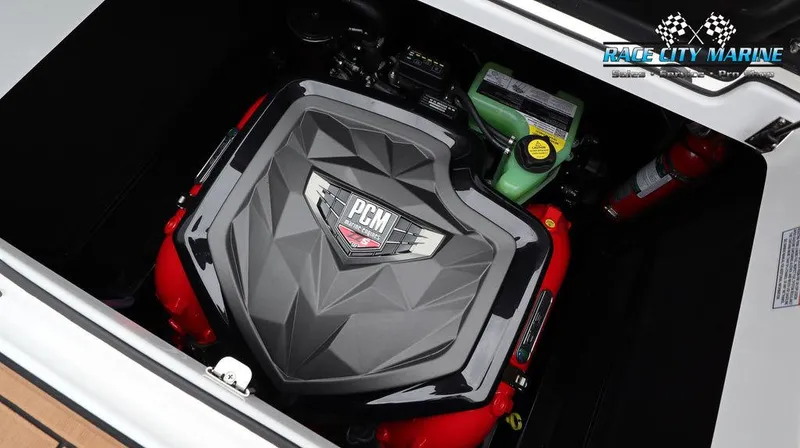 Slide: The Image of 2024 Nautique GS24 engine compartment with PCM engine and Race City Marine branding. - 20