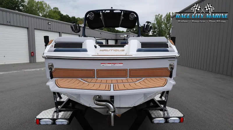 Slide: The Image of 2024 Nautique GS24 boat at Race City Marine dealership. - 3
