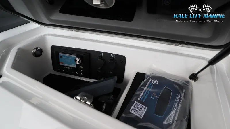 Slide: The Image of 2024 Nautique GS24 boat dashboard with JL Audio system and Race City Marine branding. - 31