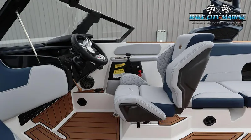 Slide: The Image of 2024 Nautique GS24 boat interior with Race City Marine branding. - 32