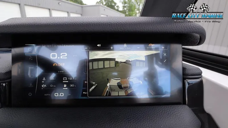 Slide: The Image of 2024 Nautique GS24 dashboard display with rearview camera at Race City Marine. - 35