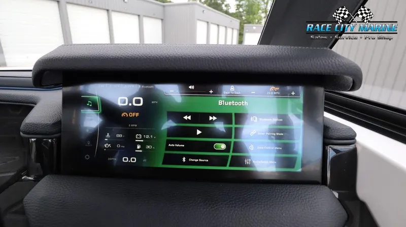 Slide: The Image of 2024 Nautique GS24 boat dashboard with touchscreen display showing Bluetooth settings. - 37