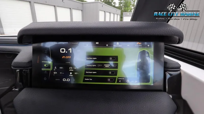 Slide: The Image of 2024 Nautique GS24 dashboard display with control settings and Race City Marine logo. - 39